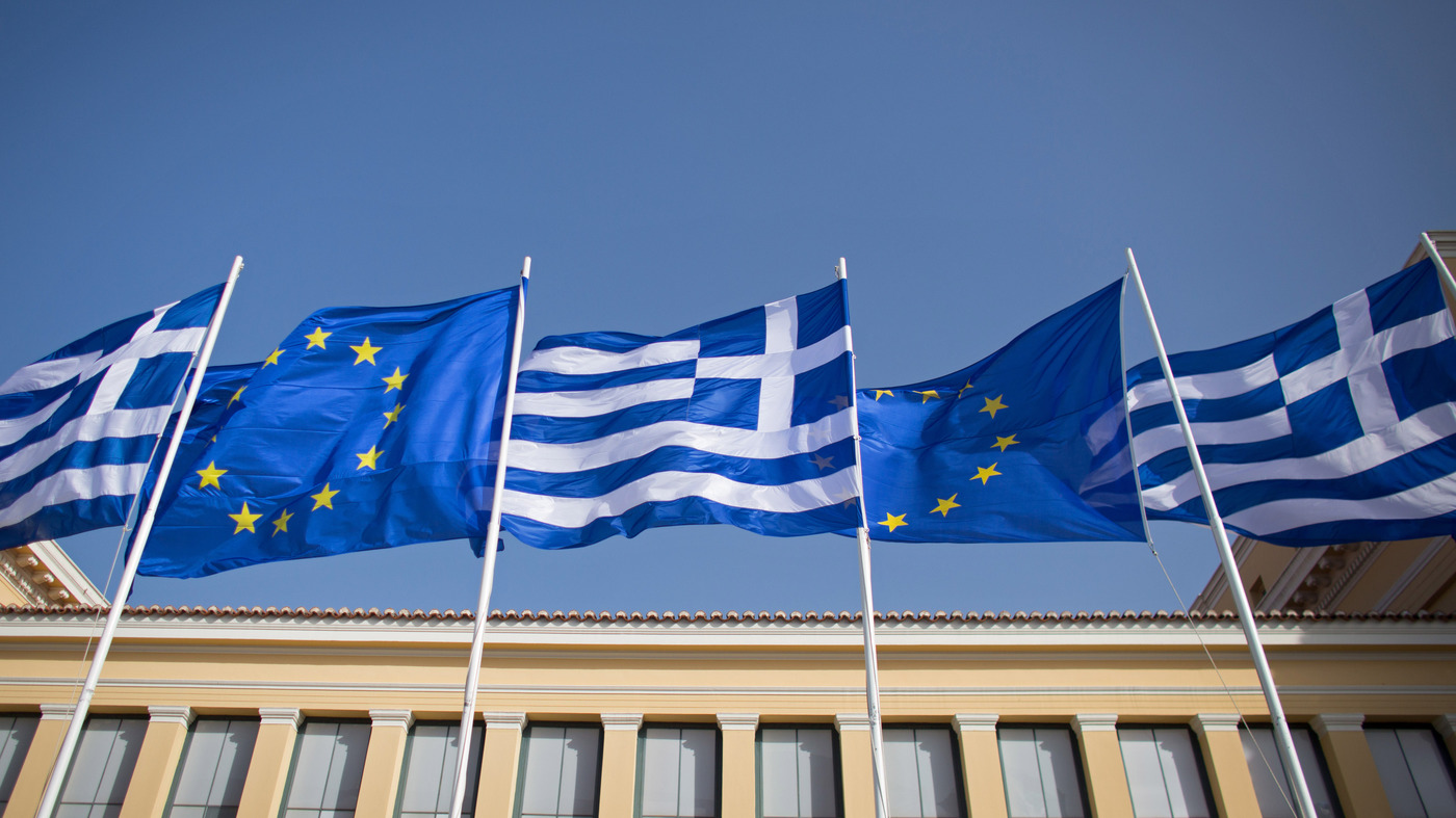Greek flags fly beside those of the European Union in Athens. Many people chalk the phrase up to Shakespeare, but its origins likely date back much earlier than that -- to medieval monks eager for a cop-ou